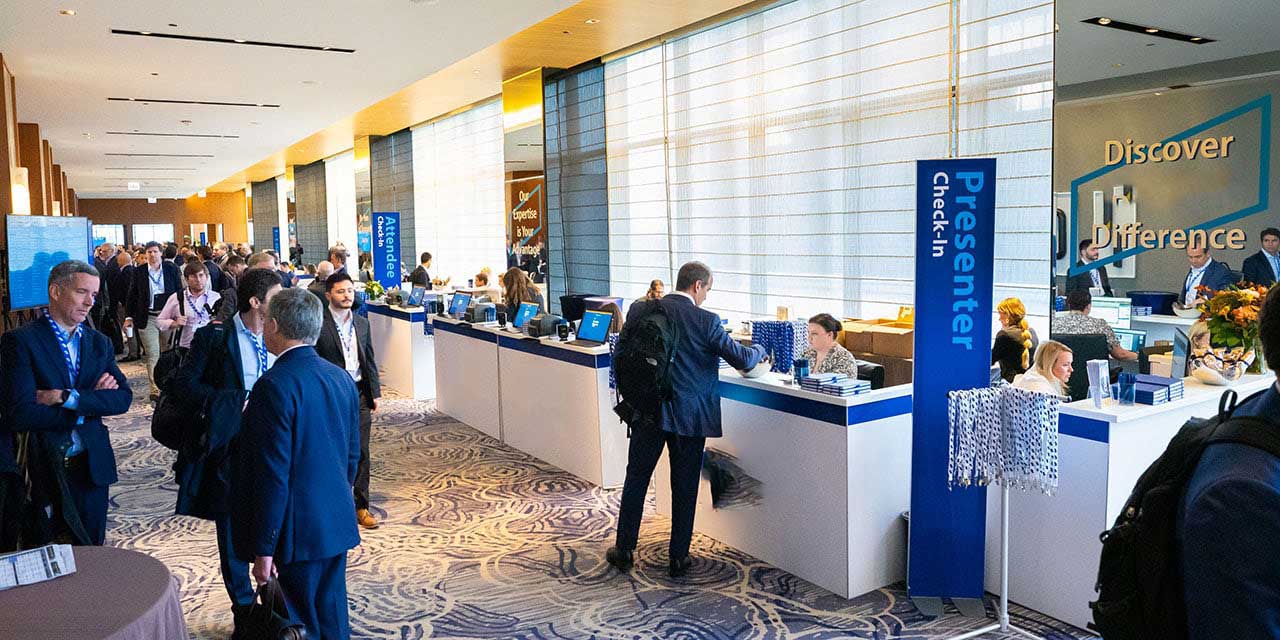Attendees in the check-in area of a Liberty Conference